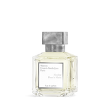 Clear glass perfume bottle with pale yellow liquid, white label, and a textured silver-toned octagonal cap.