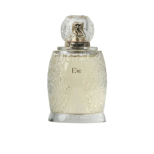 Artist’O Été Eau de Parfum in a clear ornate glass bottle with golden accents, showcasing a fresh summer-inspired fragrance design – Shop the Latest Online