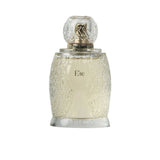 Artist’O Été Eau de Parfum in a clear ornate glass bottle with golden accents, showcasing a fresh summer-inspired fragrance design – Shop the Latest Online