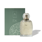 Artist’O Été Eau de Parfum in a clear ornate glass bottle with golden accents, showcasing a fresh summer-inspired fragrance design – Shop the Latest Online