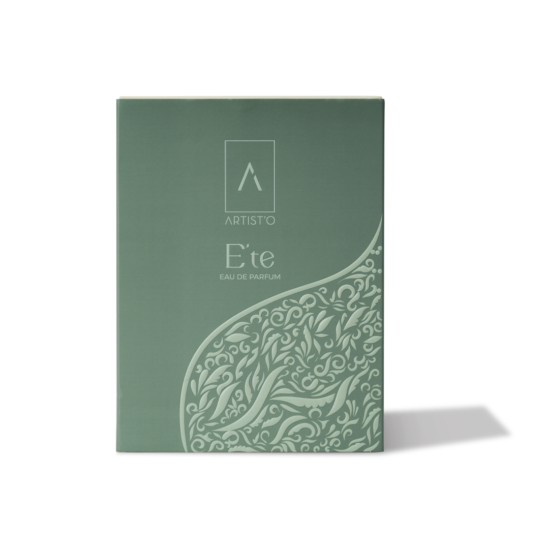 Artist’O Été Eau de Parfum in a clear ornate glass bottle with golden accents, showcasing a fresh summer-inspired fragrance design – Shop the Latest Online