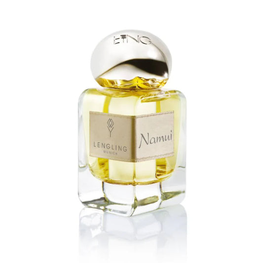 A close-up of the Lengling Munich Namui Extrait de Parfum glass bottle, showcasing the gold-hued fragrance, silver cap, and signature fabric label.