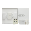 A luxury white gift set from Lorenzo Villoresi Firenze containing Teint de Neige Eau de Parfum, Hair Mist, and Scented Body Powder with a white fluffy puff, all arranged in a premium white presentation box.