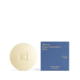 The Maison Francis Kurkdjian 724 scented soap bar displayed next to its vibrant blue square packaging with gold-stamped lettering.
