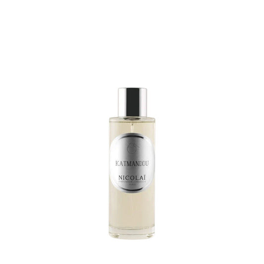 A matte glass bottle of Memo Paris Palais Bourbon featuring a golden neoclassical illustration of three figures.