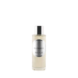 A matte glass bottle of Memo Paris Palais Bourbon featuring a golden neoclassical illustration of three figures.