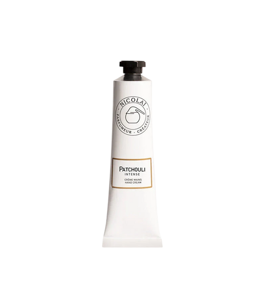 A white squeeze tube of Nicolaï Patchouli Intense Hand Cream featuring a black octagonal cap and the brand's classic circular logo.