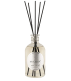 Nicolai Musc Blanc diffuser bottle with black reeds on a white background.