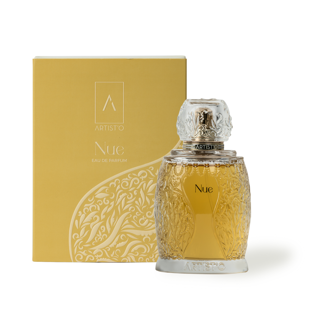 Artist’O Nue Eau de Parfum in an ornate clear glass bottle with golden fragrance tones, displayed with matching luxury packaging – Now Online