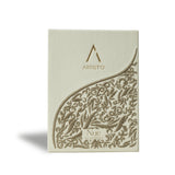Artist’O Nue Eau de Parfum in an ornate clear glass bottle with golden fragrance tones, displayed with matching luxury packaging – Now Online