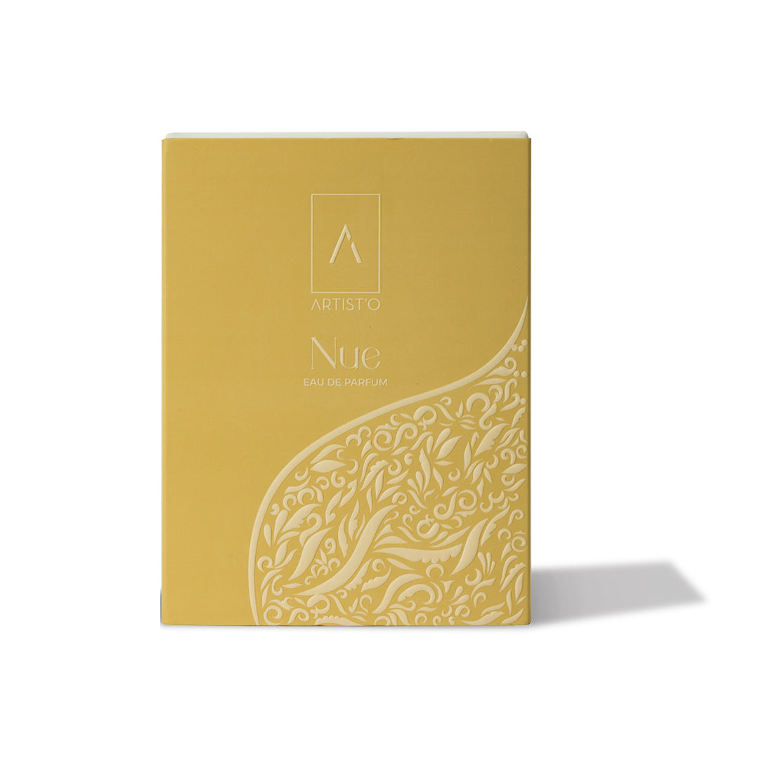 Artist’O Nue Eau de Parfum in an ornate clear glass bottle with golden fragrance tones, displayed with matching luxury packaging – Now Online