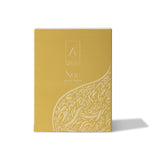 Artist’O Nue Eau de Parfum in an ornate clear glass bottle with golden fragrance tones, displayed with matching luxury packaging – Now Online