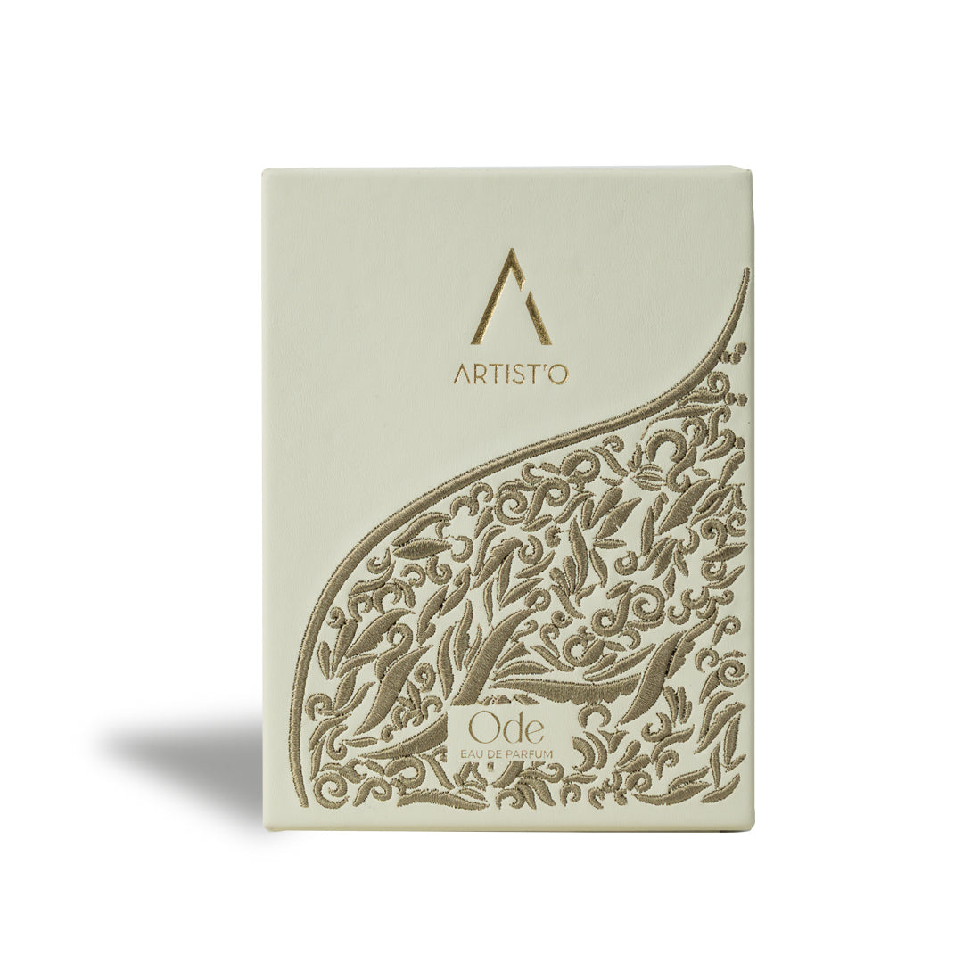 Artist’O Ode Eau de Parfum in an ornate clear glass bottle with a soft ivory fragrance, displayed with pastel pink luxury packaging – Find Online Today