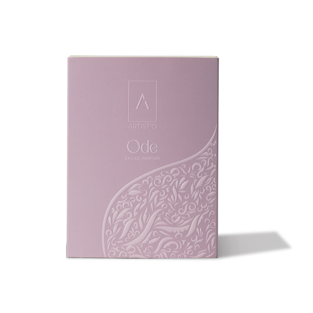 Artist’O Ode Eau de Parfum in an ornate clear glass bottle with a soft ivory fragrance, displayed with pastel pink luxury packaging – Find Online Today