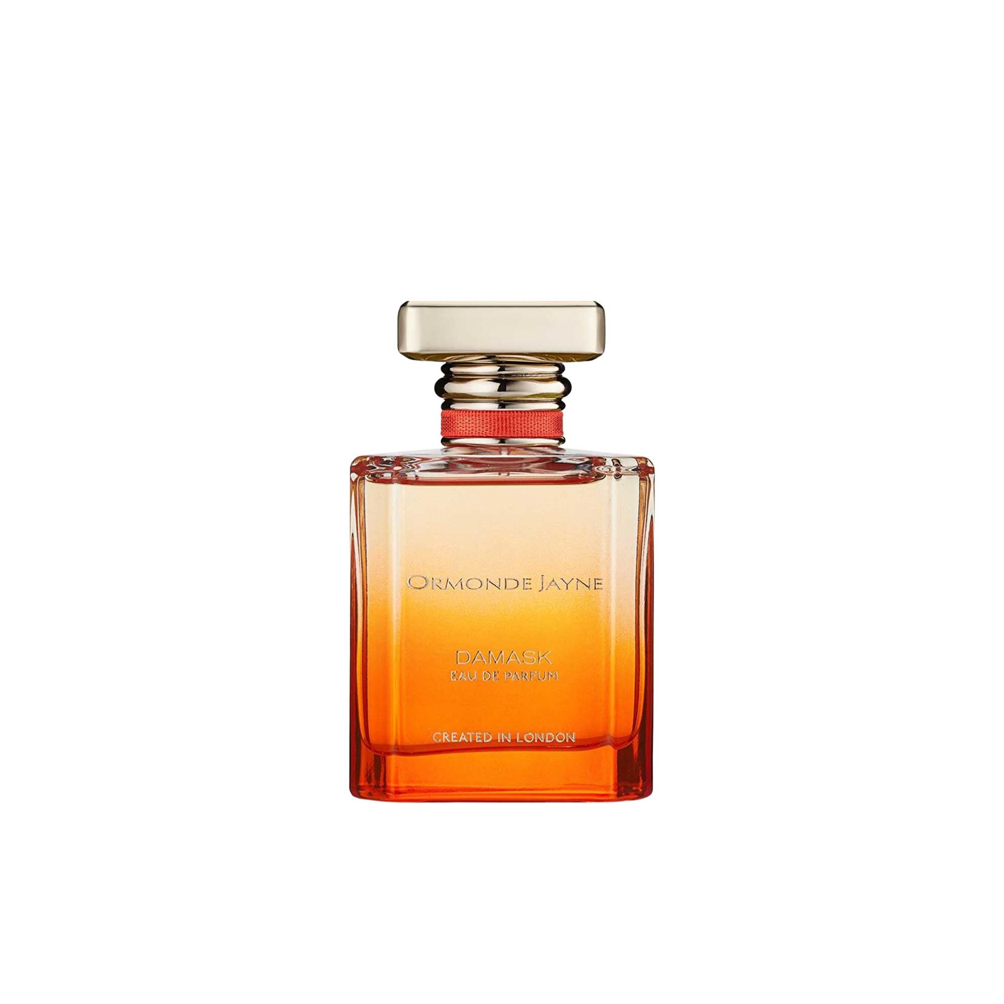 A 50ml bottle of Ormonde Jayne Damask Eau de Parfum featuring an orange gradient glass bottle, a gold rectangular cap with a red ribbon detail, and gold text.