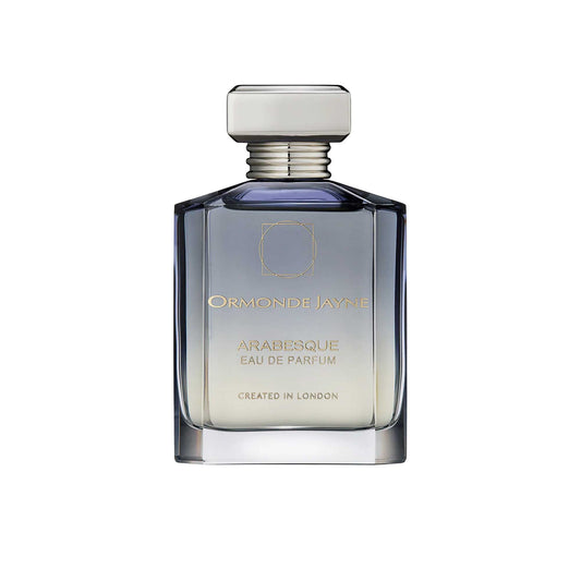 An 88ml smoky grey-to-clear gradient glass bottle of Ormonde Jayne Arabesque Eau de Parfum, featuring gold lettering and topped with a tiered silver neck and rectangular silver cap.