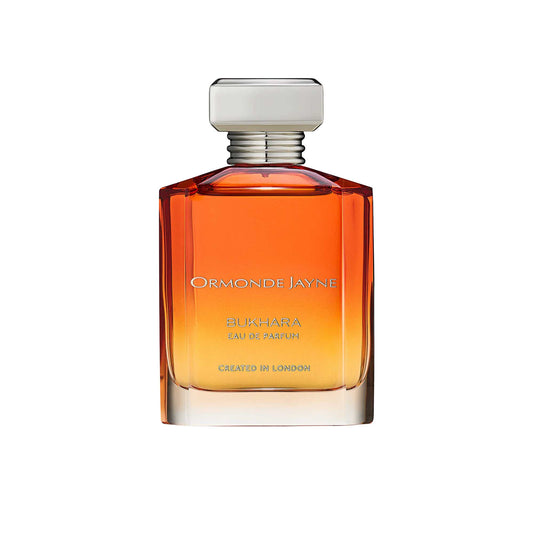 An 88ml orange gradient glass bottle of Ormonde Jayne Bukhara Eau de Parfum, featuring silver lettering and topped with a tiered silver neck and rectangular silver cap.