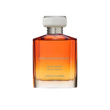 An 88ml orange gradient glass bottle of Ormonde Jayne Bukhara Eau de Parfum, featuring silver lettering and topped with a tiered silver neck and rectangular silver cap.
