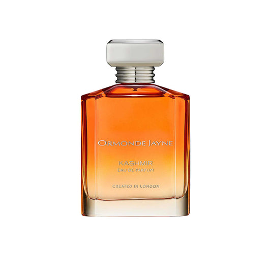 An 88ml orange gradient glass bottle of Ormonde Jayne Kashmir Eau de Parfum, featuring silver lettering and topped with a tiered silver neck and rectangular silver cap.