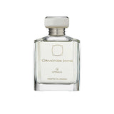 An 88ml clear glass bottle of Ormonde Jayne Qi Intensivo featuring a silver tiered neck and a rectangular silver cap, filled with a light-colored fragrance.