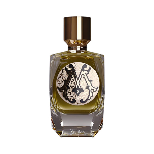 Rectangular glass perfume bottle with faceted base, containing olive-green liquid, a black and cream ornate label, and a gold