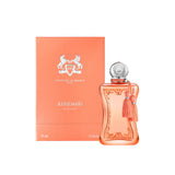A luxury bottle of Parfums de Marly Athénaïs Eau de Parfum in 75ml next to its peach-colored textured box. The bottle is a frosted peach glass with ornate carvings, a silver spherical cap, and peach silk tassels. The box features the silver Parfums de Marly horse logo and the name "ATHÉNAÏS" in silver typography against a clean white background.