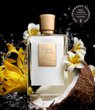 Perfume bottle with flowers and coconut, featuring a 2023 Fragrance Foundation Award winner badge.