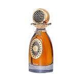 Amber perfume in a clear bottle with a dark gray base. Gold-toned cap with black honeycomb top. Gold-toned details with black