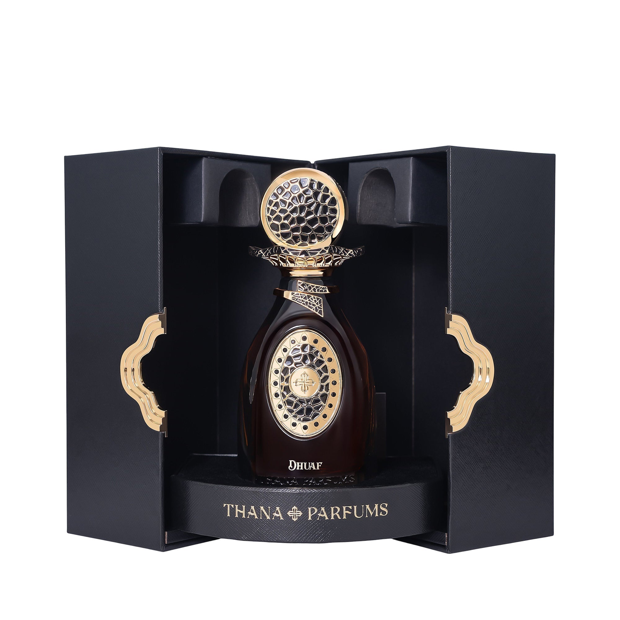 Dark amber perfume bottle with a gold-toned ornate cap and front design, displayed in a black textured box with gold-toned wa