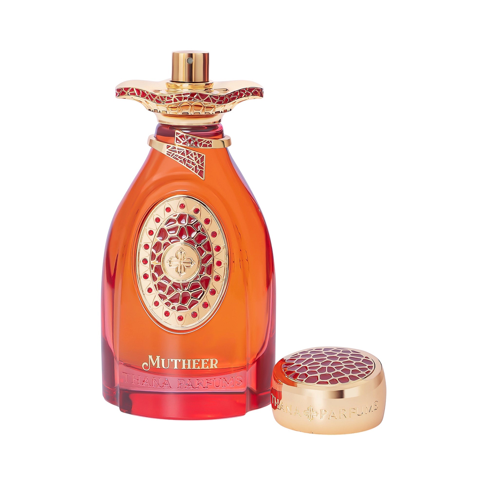 Orange-red perfume bottle with gold-toned accents and red ornate patterns. Separate gold-toned cap with a red patterned top.