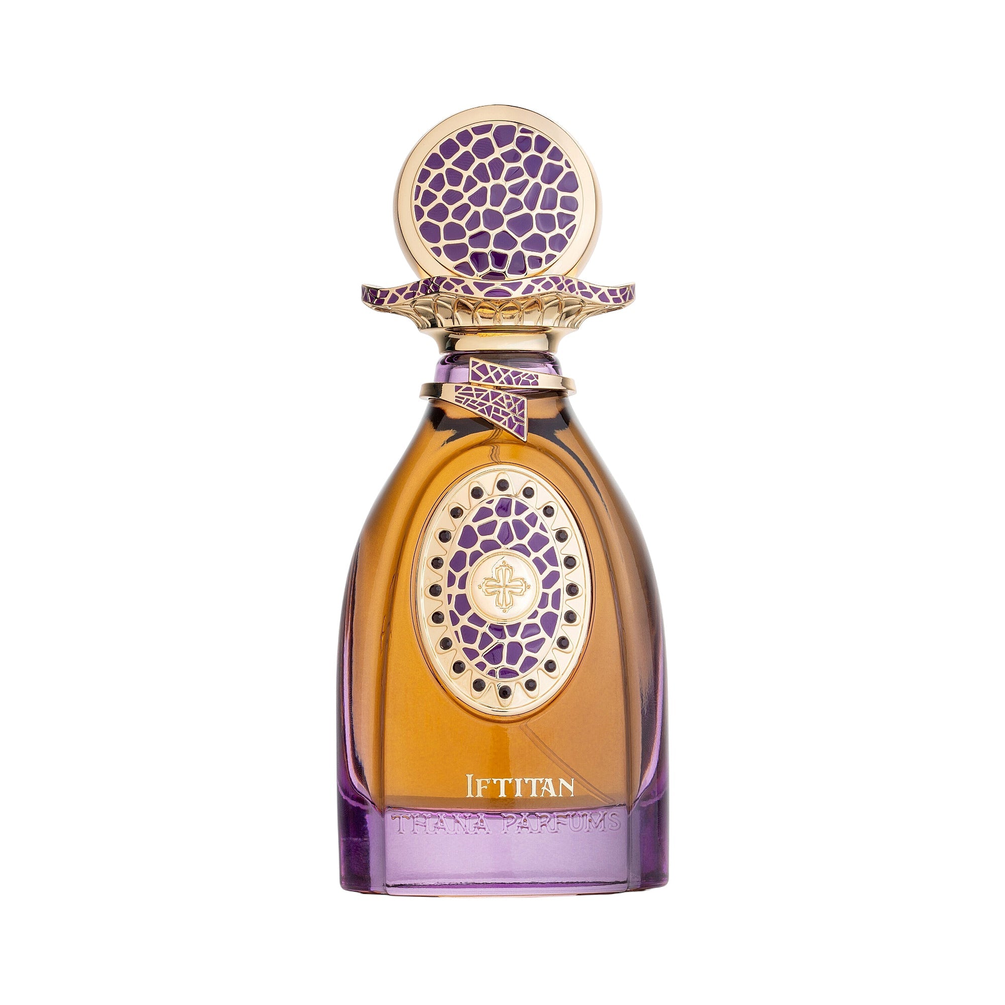 Amber liquid perfume in a glass bottle with a purple base and gold-toned, purple patterned cap and medallion.