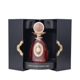 Dark red perfume bottle with gold-toned textured cap, decorative neck, and oval label, presented in an open black box with go