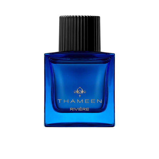 A 100ml square vibrant blue glass bottle of Thameen Rivière featuring gold lettering and topped with a textured black cylindrical cap