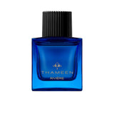 A 100ml square vibrant blue glass bottle of Thameen Rivière featuring gold lettering and topped with a textured black cylindrical cap