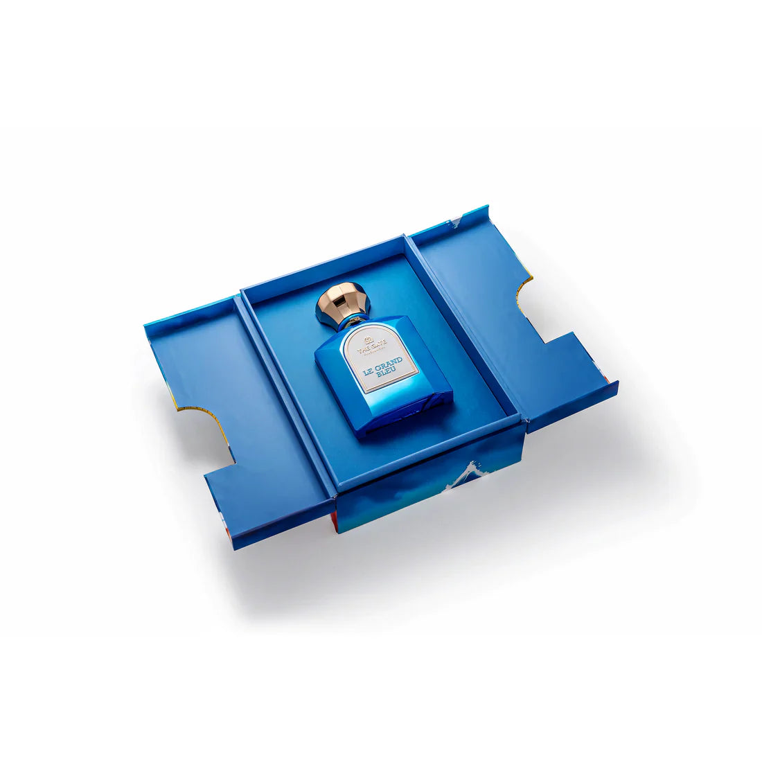The Gate Fragrances Le Grand Bleu Extrait de Parfum blue glass bottle with gold cap and white label.