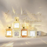 Clear glass rectangular perfume bottle with amber liquid, white label, and a gold-toned rectangular cap.