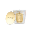 The Xerjoff Dark Violette candle displayed inside its open luxury gift box. The packaging features a striking purple and white marble design with gold foil accents.