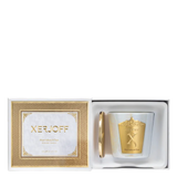 The luxury packaging for the Xerjoff Marrakech Tea candle, featuring a vibrant green and white marble-patterned box with gold-foil accents and the brand's signature "X" logo.