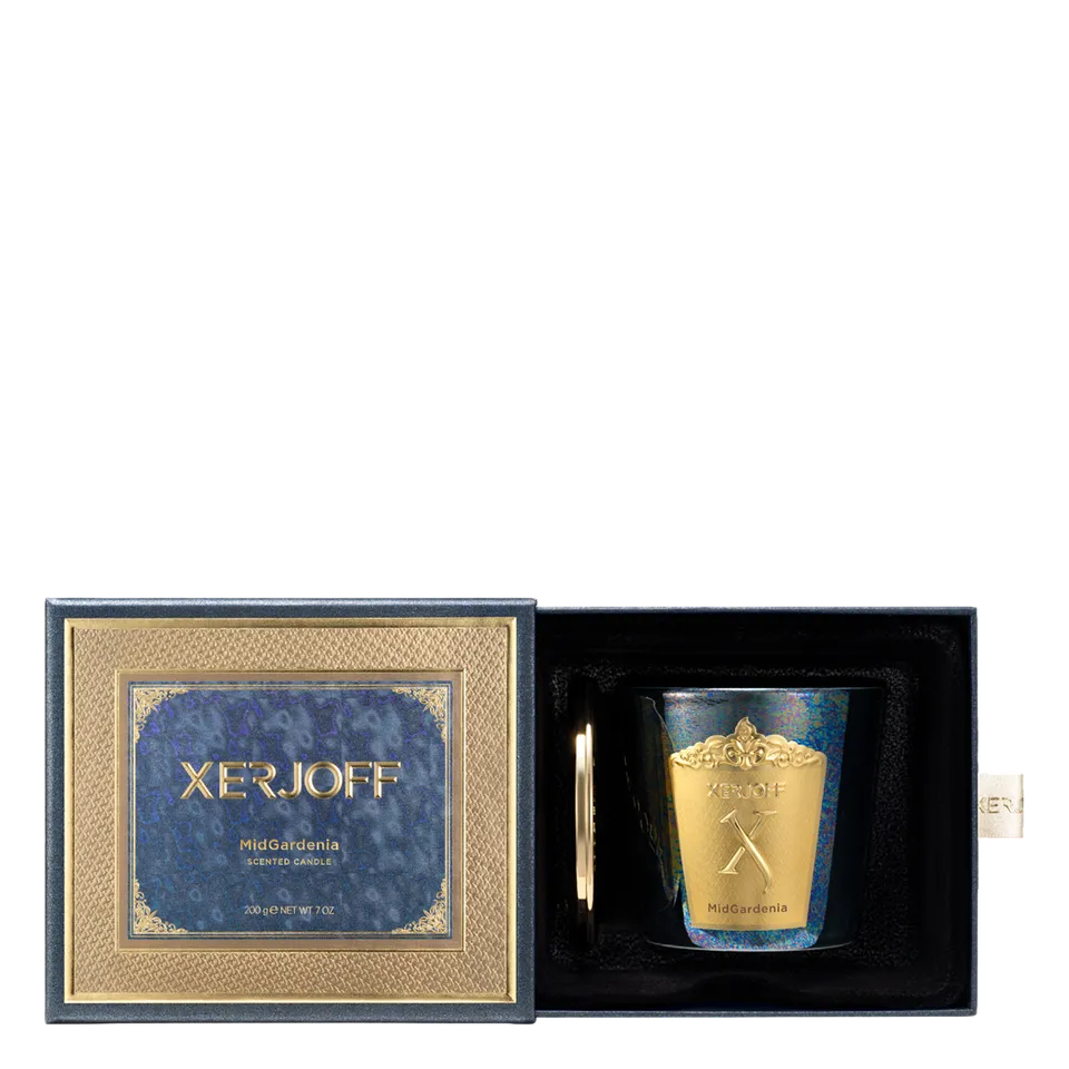 The luxury packaging for the Xerjoff Midgardenia candle, featuring an ivory and soft grey marble-patterned box with gold-foil accents and the brand's iconic "X" logo.