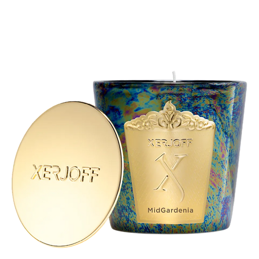 The Midgardenia scented candle in a tapered off-white glass holder, displaying a gold star-patterned label and the embossed Xerjoff emblem.