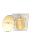 A Xerjoff TuberHype scented candle and its polished gold lid displayed inside a white luxury presentation box with a gold textured frame.