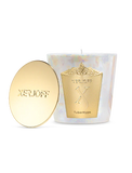 A Xerjoff TuberHype scented candle and its polished gold lid displayed inside a white luxury presentation box with a gold textured frame.