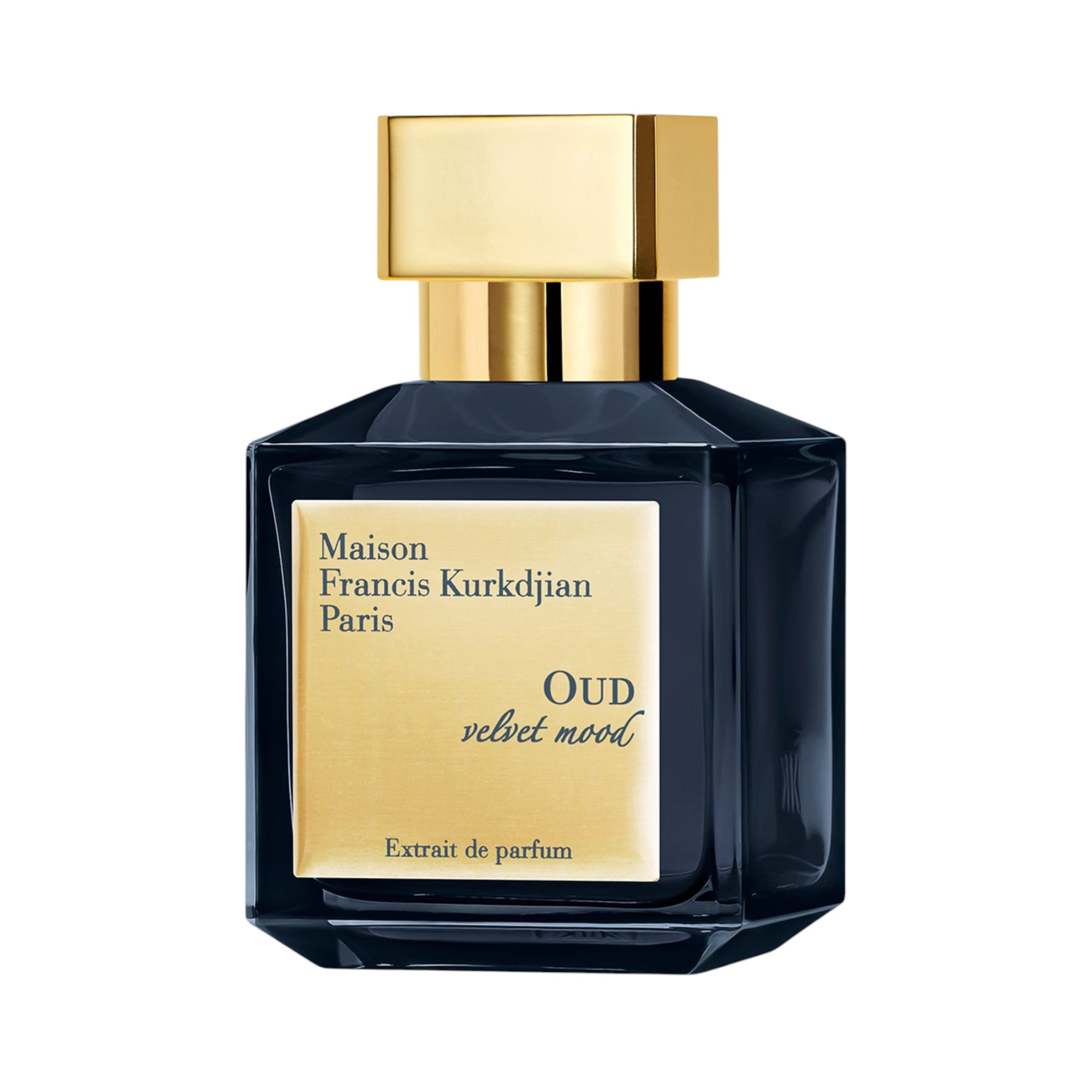 Dark blue faceted glass perfume bottle with a gold-toned rectangular cap and a gold-toned label reading 'OUD velvet mood'.