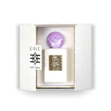Abercrombie & Fitch Cave Essential Secret Tuberose luxury parfum bottle with white finish, gold label, and purple marbled cap.