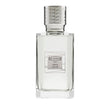 Clear rectangular glass perfume bottle with a light liquid and a silver-toned textured cap, featuring a white and grey label.